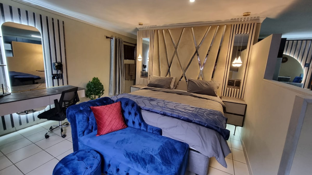 King sized bed with usb charging ports on side tables.