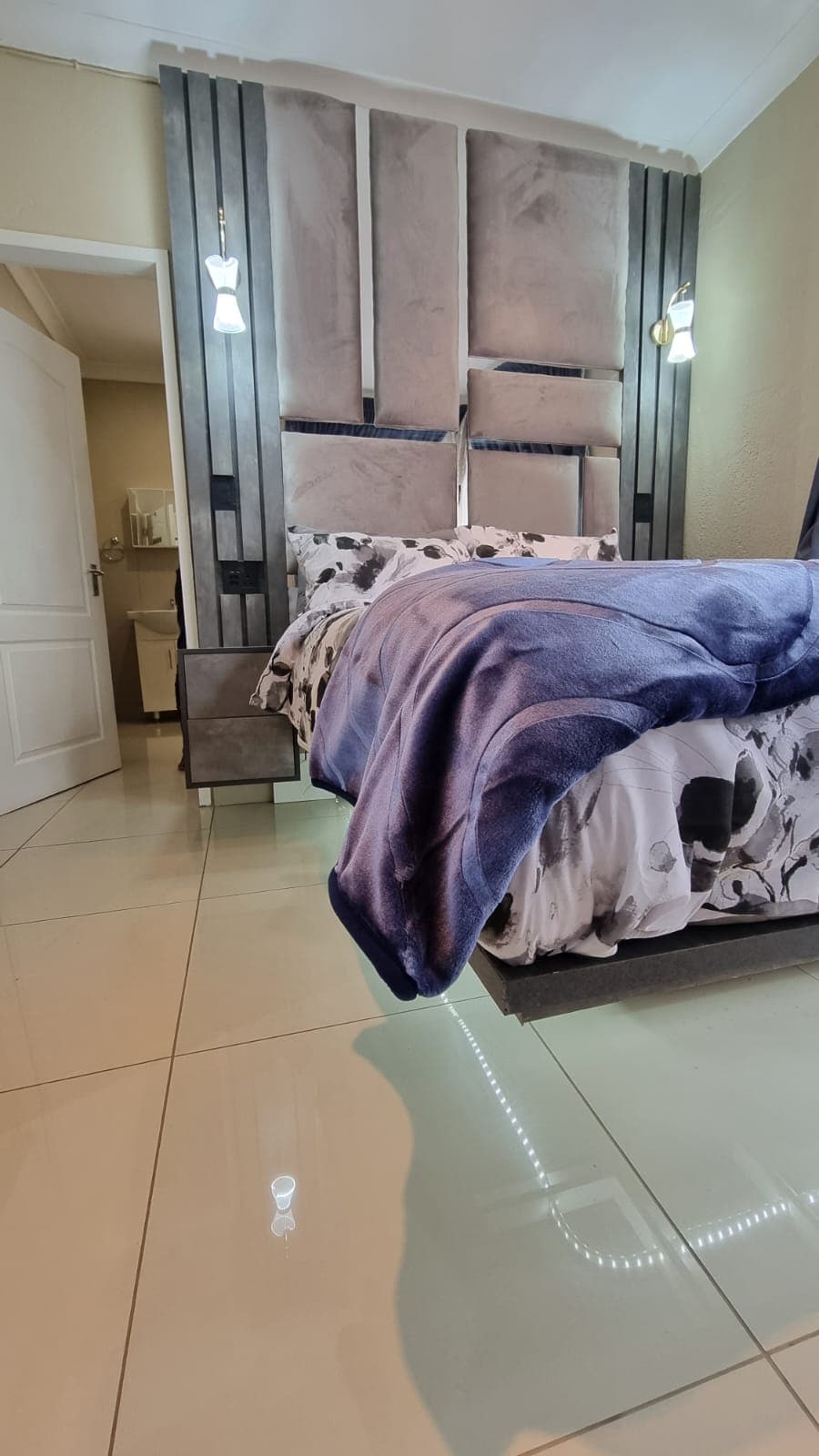 Floating double LED lit bed with USB charging ports on side tables