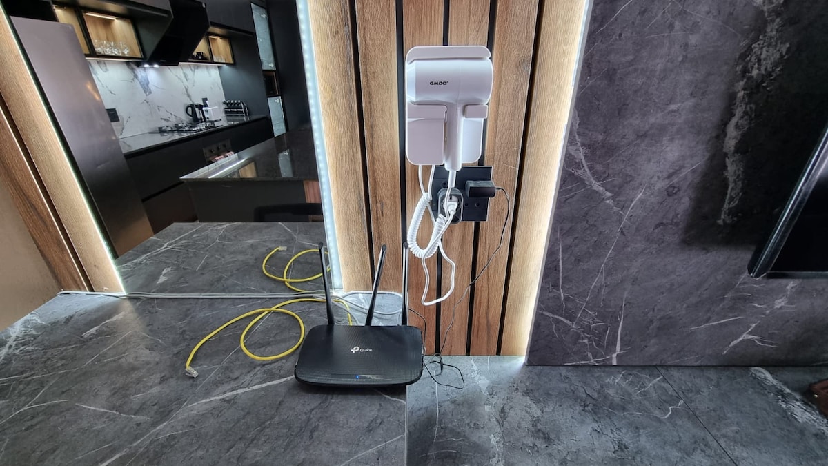 Dedicated workspace with ethernet cable and hairdryer.