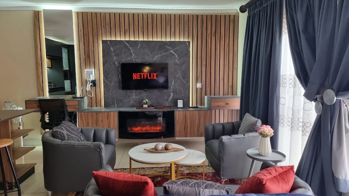 Smart TV with netflix subscription. LED electric fireplace for winters. Workspace area with hairdryer and ethernet cable.