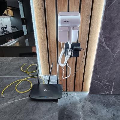 Dedicated workspace with ethernet cable and hairdryer.