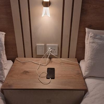 USB ports and plugs at bed side for charging.