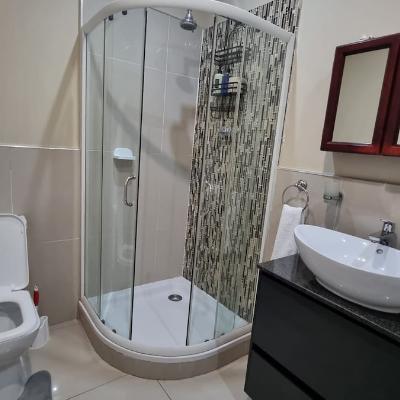 Full bathroom with shower and bathtub.