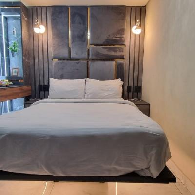 LED lit floating bed with ensuite bathroom.