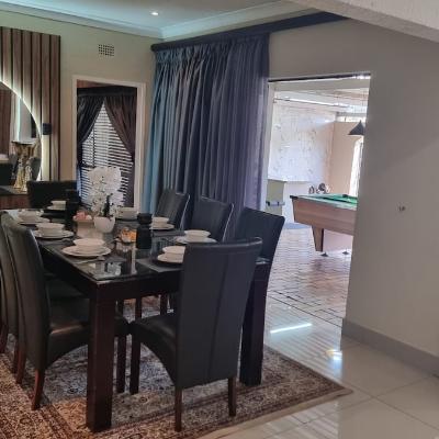 8 seater dining table over looking the entertainment area