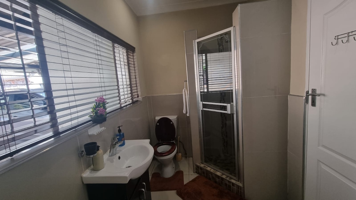 Bathroom with shower and bathtub