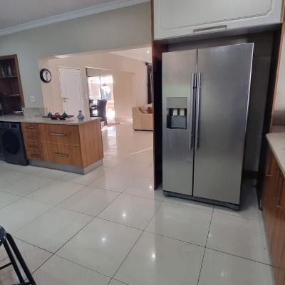 Full kitchen with dishwasher and washer dryer combo machines