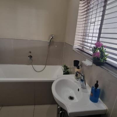 Bathroom with shower and bathtub
