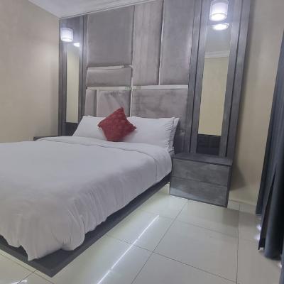 Floating LED lit queen sized bed with electric blanket, USB charging nightstands, ensuite bathroom and room darkening shades.