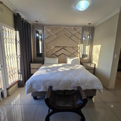 King sized bed with electric blanket, USB charging nightstands and room darkening shades.
