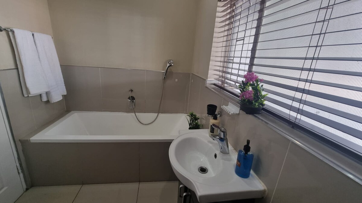 Bathroom with shower and bathtub