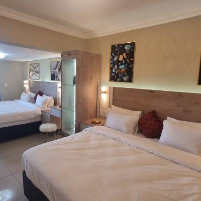 Large master bedroom with 2 large king sized beds with electric blankets, USB night stand outlets, ensuite bathroom and room darkening shades.