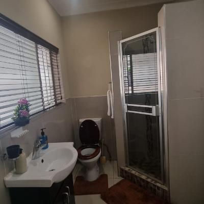 Bathroom with shower and bathtub