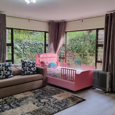 Master bedroom with queen sized bed and single bed.