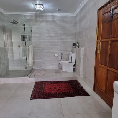 bathroom with shower and bathtub