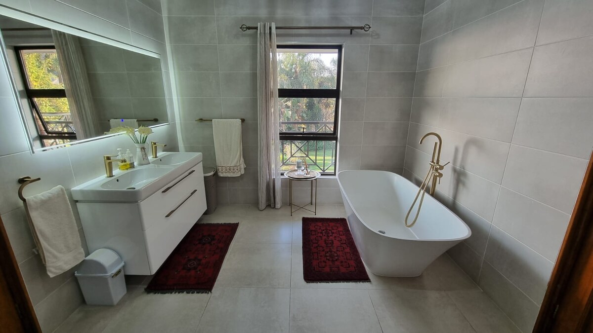 Bathroom with shower and bathtub