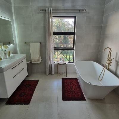 Bathroom with shower and bathtub