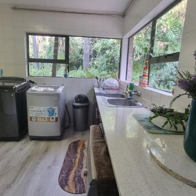Laundry room with washing machines and dishwasher
