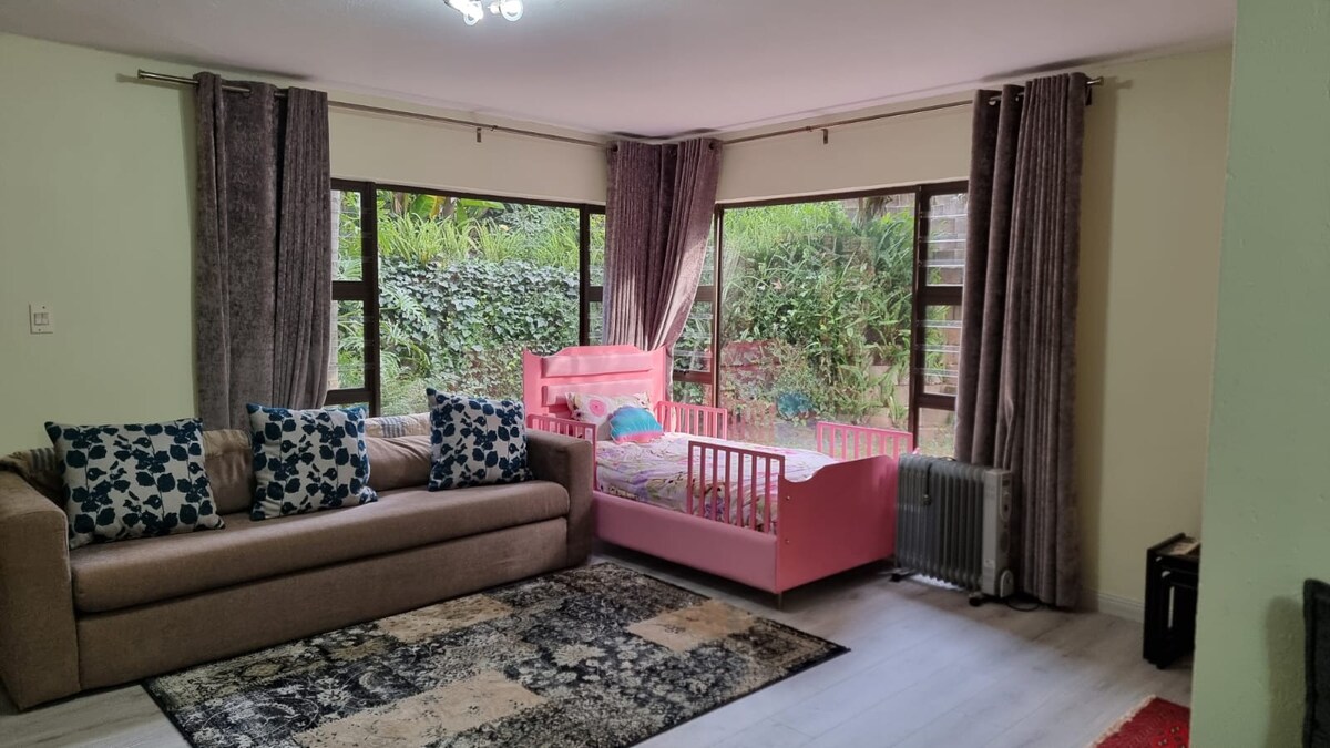 Master bedroom with queen sized bed and single bed.