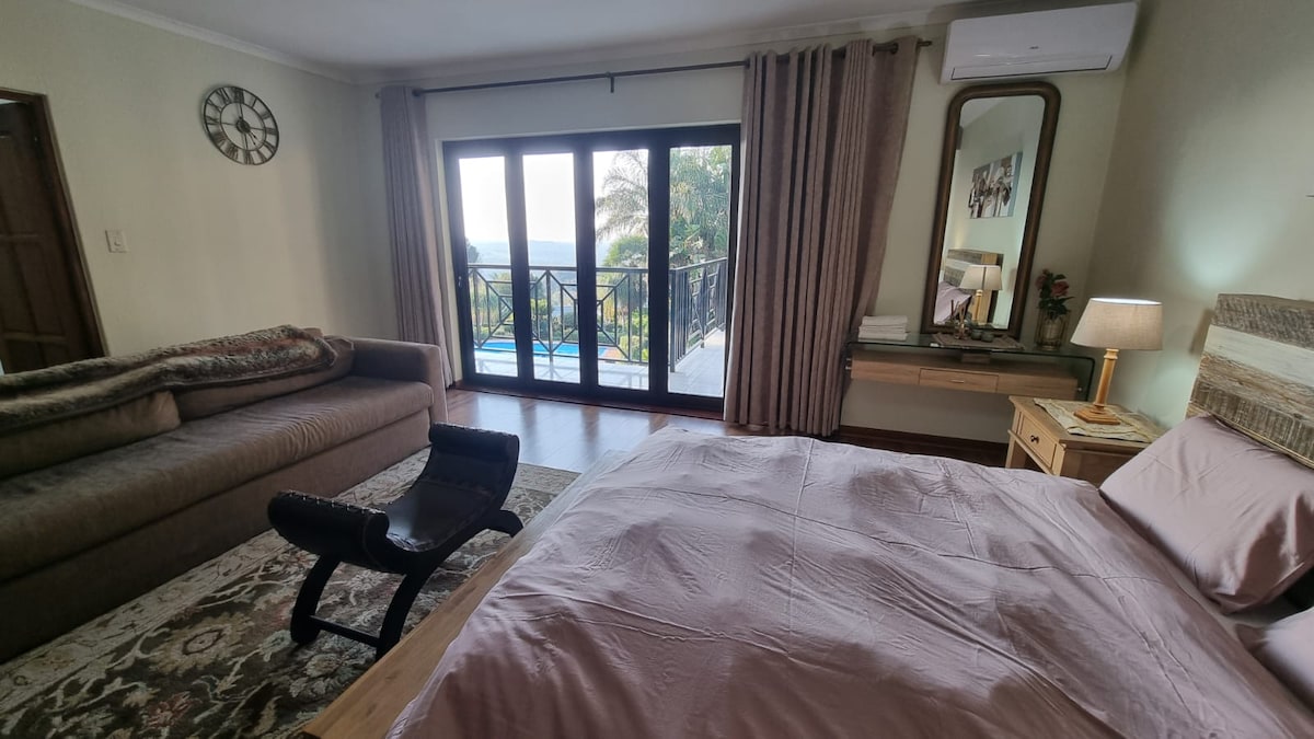 Queen sized bed with electric blanket and panoramic views.