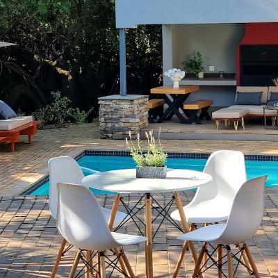 Solar heated pool with outdoor lounge furniture and outdoor BBQ/braai area