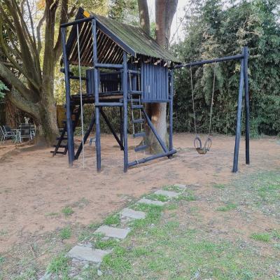 Let the kids play in the jungle gym and enjoy the lush garden