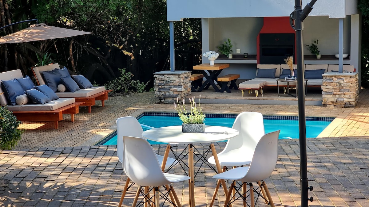 Solar heated pool with outdoor lounge furniture and outdoor BBQ/braai area