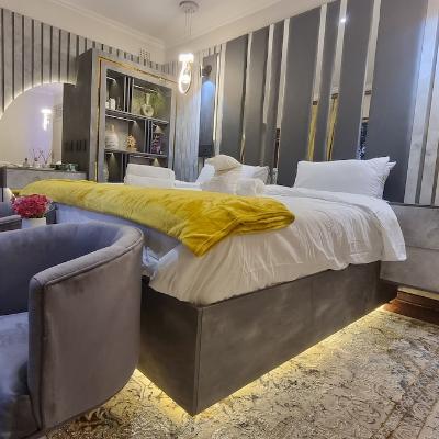 Super king size LED lit bed with dressing table overlooking the pool and garden area. 