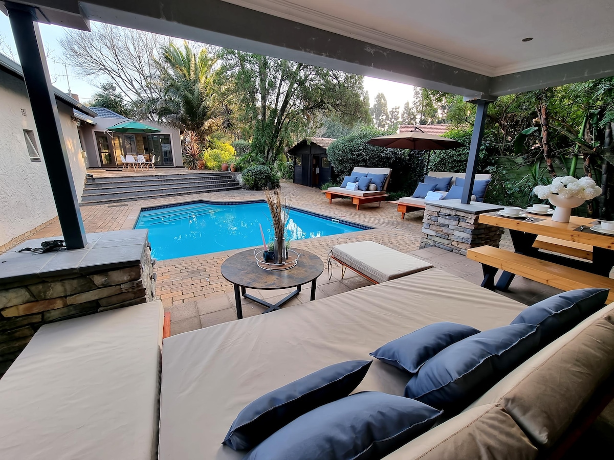 Covered patio area overlooking pool.