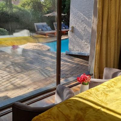 Super king sized bedroom overlooks the garden and pool area.