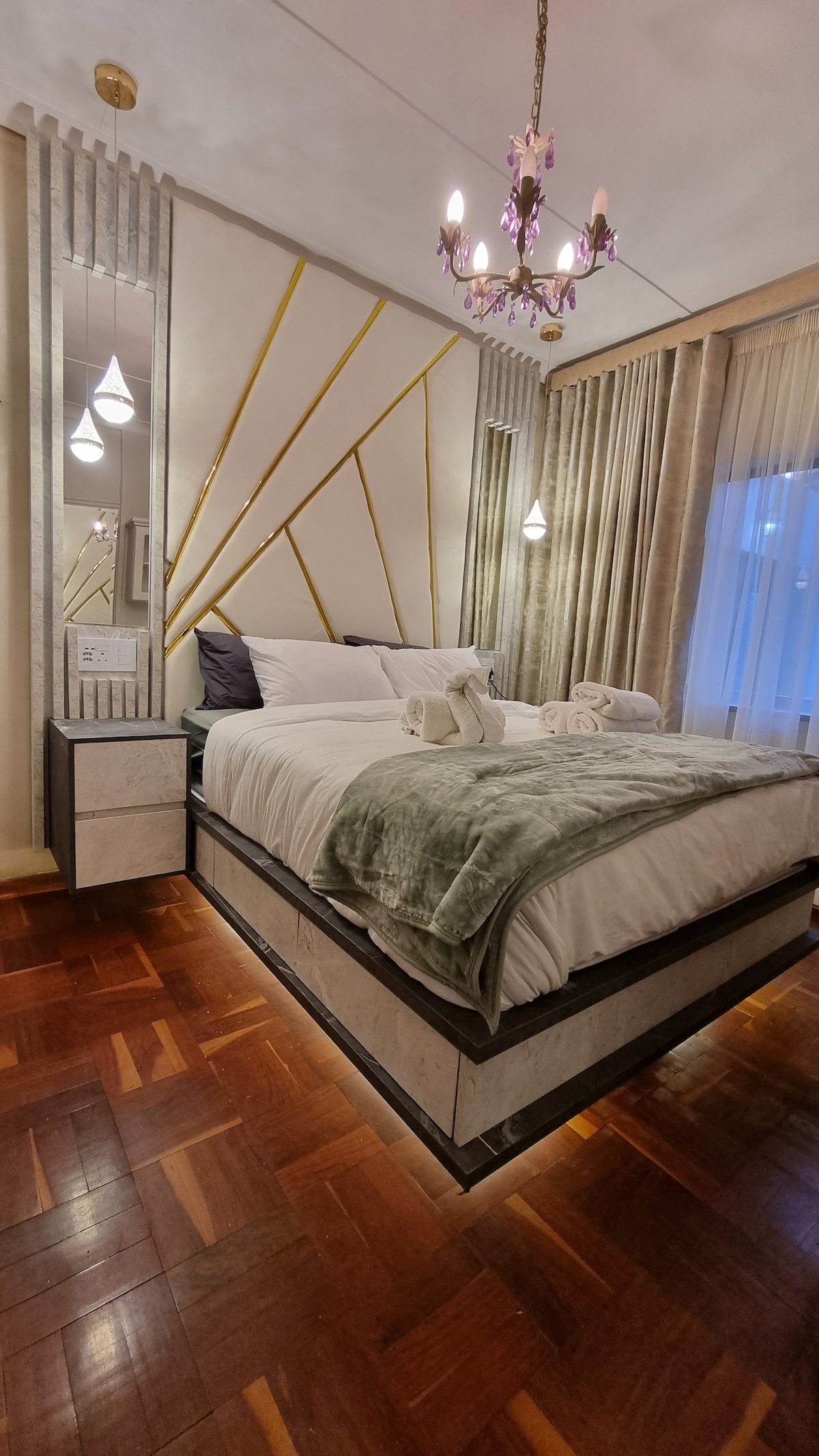 A queen sized LED lit floating bed with nights stands that have USB ports. Queen sized bed has an electric blanket to keep warm on cold nights.