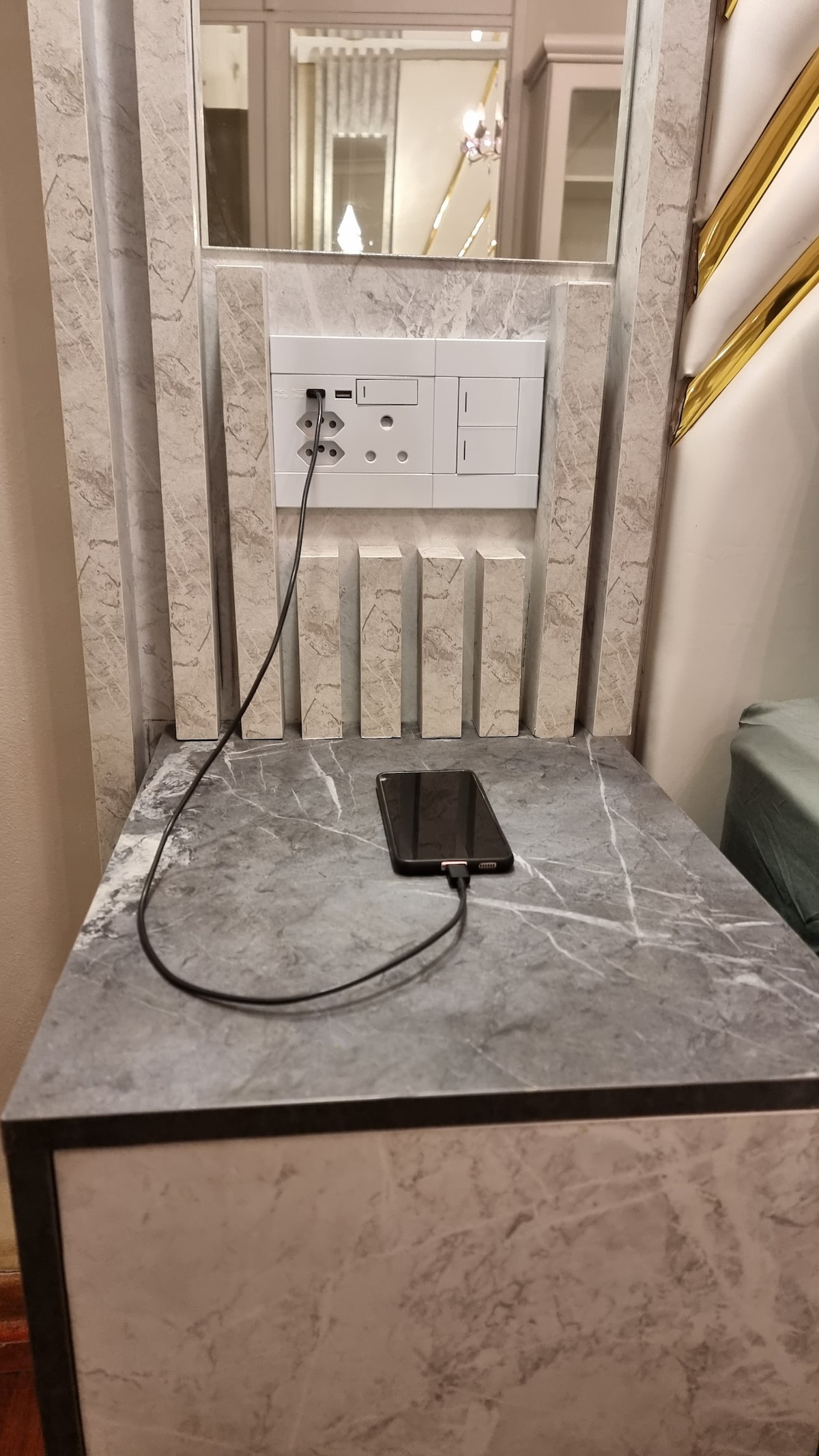 Queen sized bed has night stands with USB ports to charge devices.