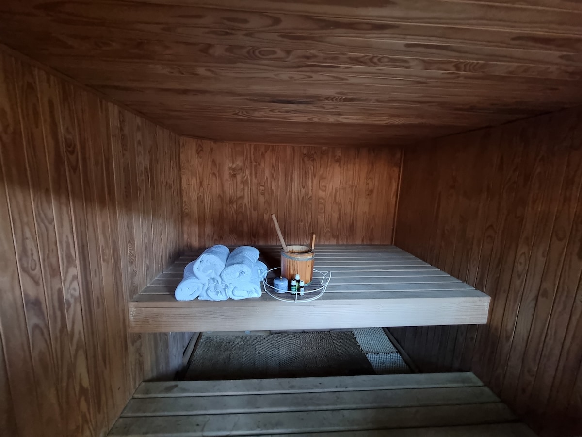 Large 6 person sauna overlooking the pool area.