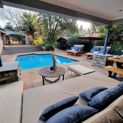 Covered patio area overlooking pool.
