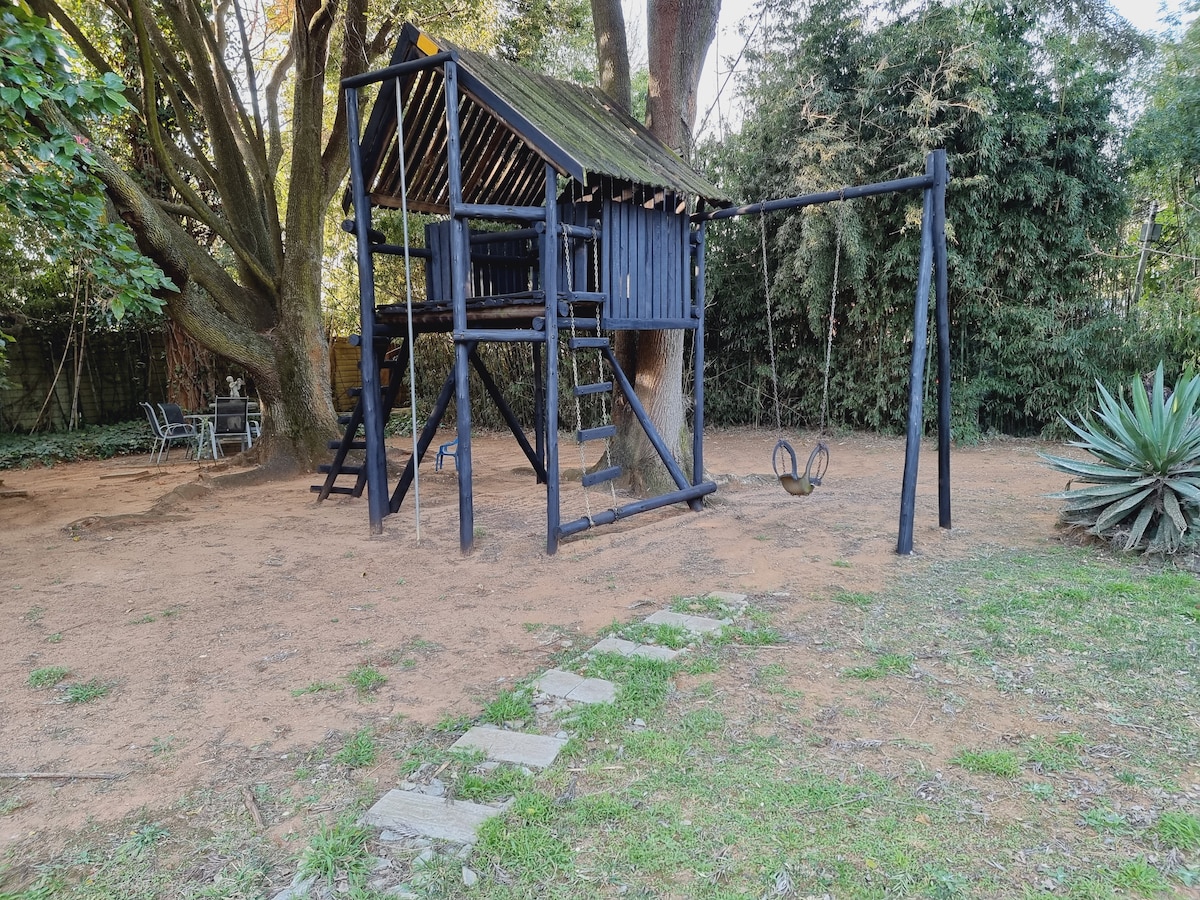 Let the kids play in the jungle gym and enjoy the lush garden