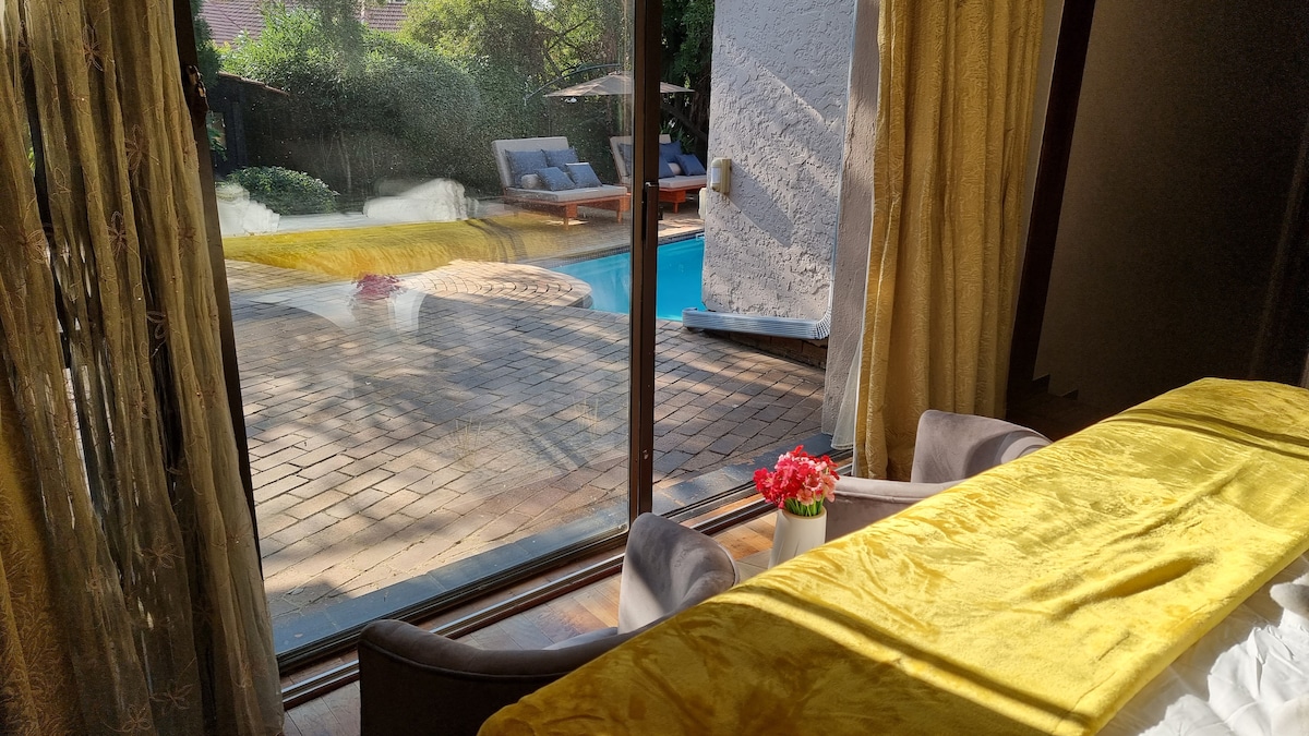 Super king sized bedroom overlooks the garden and pool area.