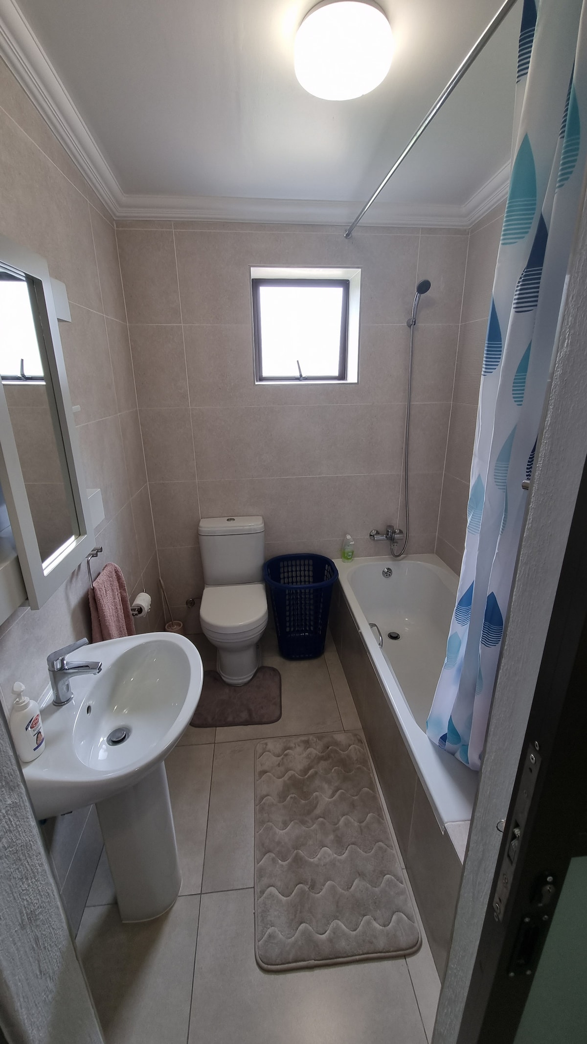 Bathroom with bath shower.
