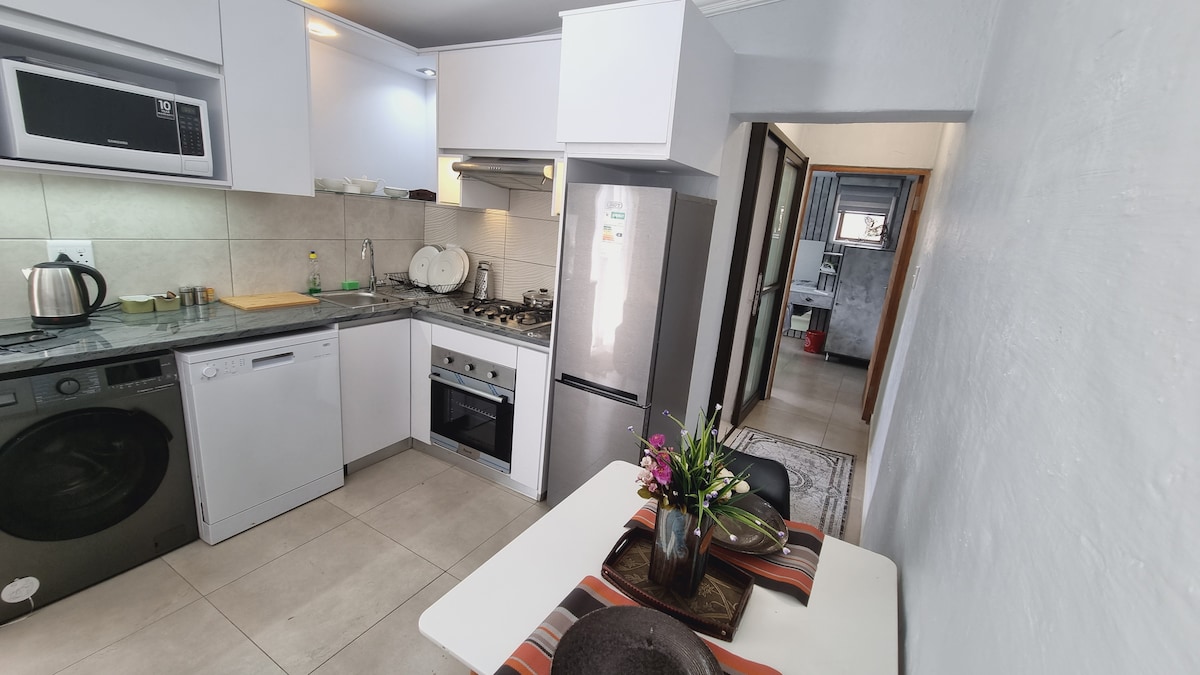 Fully stocked kitchen with dishwasher, washing machine/dryer combo, gas stove and oven.
