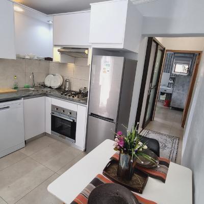 Fully stocked kitchen with dishwasher, washing machine/dryer combo, gas stove and oven.