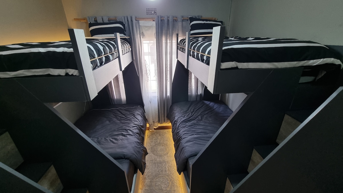 LED lit bunk beds, bottom are 3/4 size and top are single size beds with electric blankets and USB plugs