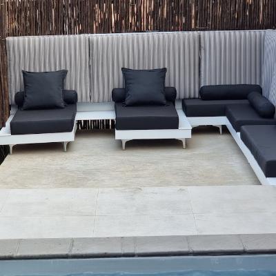 Outdoor day loungers and day beds overlooking the splash pool