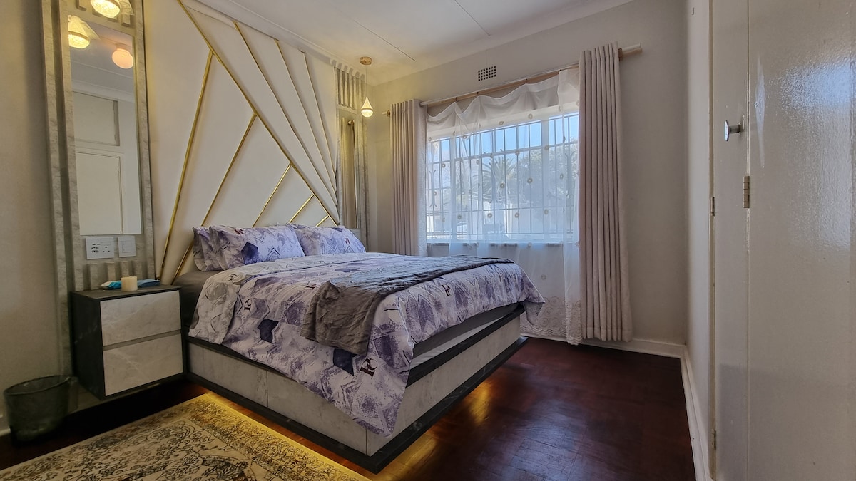 Floating LED light queen sized bed with USB side pedestals and electric blanket